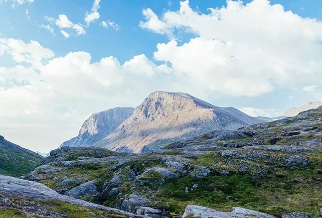 Scenic mountain landscape with rocky terrain, a perfect destination for adventure trips and trekking.