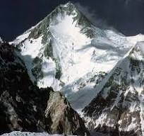 Aerial view of Gasherbrum I, the  Hidden Peak, covered in snow. An ultimate challenge for extreme mountaineers in the Karakoram Range.