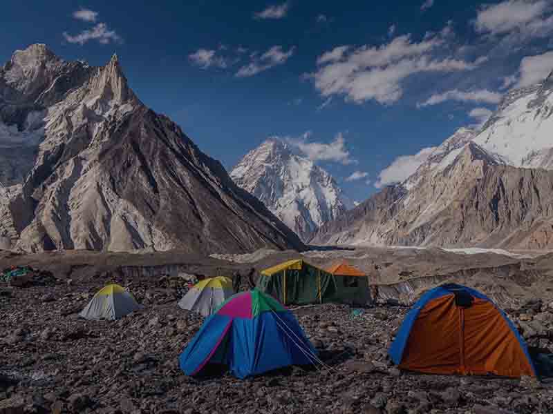 Trekkers hiking along the best route to K2 Concordia through the Baltoro Glacier