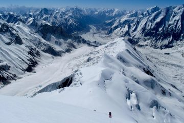 A breathtaking view of Spantik Peak's snow-covered ridges in the Karakoram Range, Pakistan, showcasing the thrilling mountaineering and trekking expedition experience.